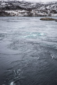 Eddies forming in the fast flowing currents of the Saltstraumen maelstrom, Nordland, Norway